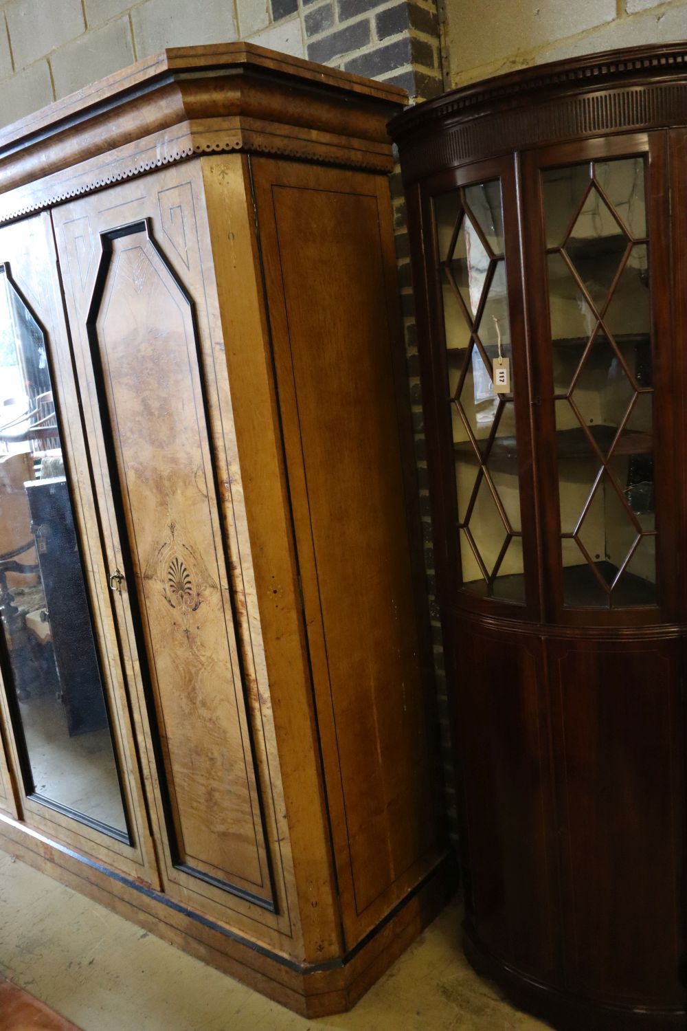 A late Victorian inlaid burr oak triple wardrobe, width 220cm depth 68cm height 221cm